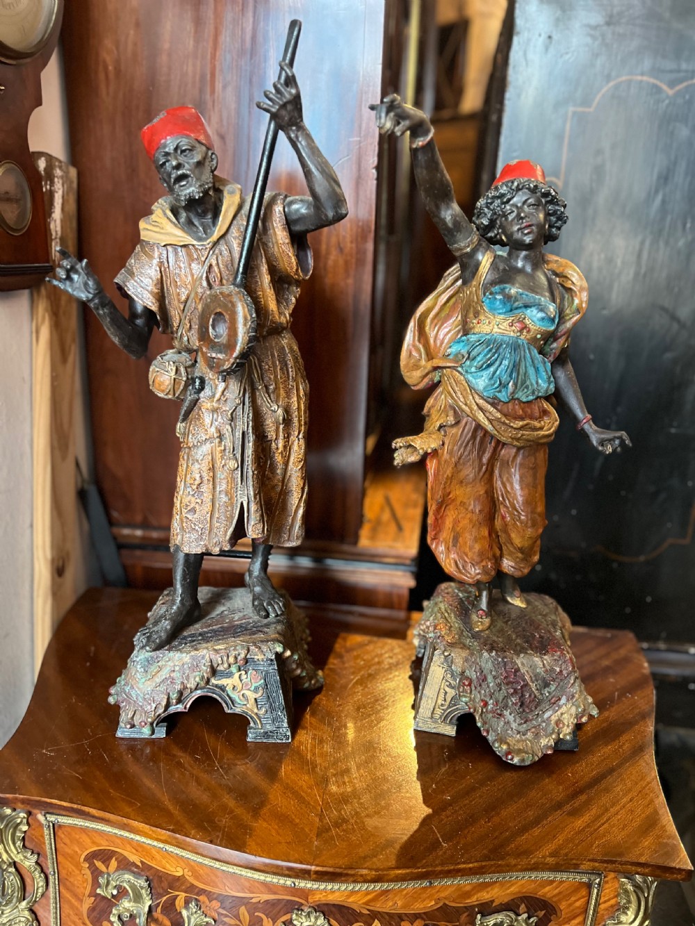 Pair of large painted spelter figures of Moroccan dancer and musician 