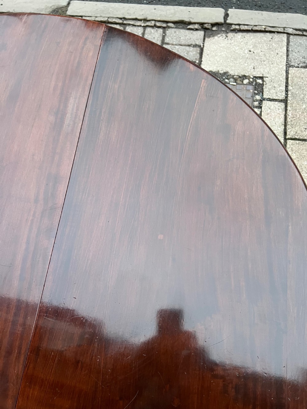 An 18th-century Cuban mahogany drop leaf table with curved cabriole legs and carved pointed pad feet. View IX
