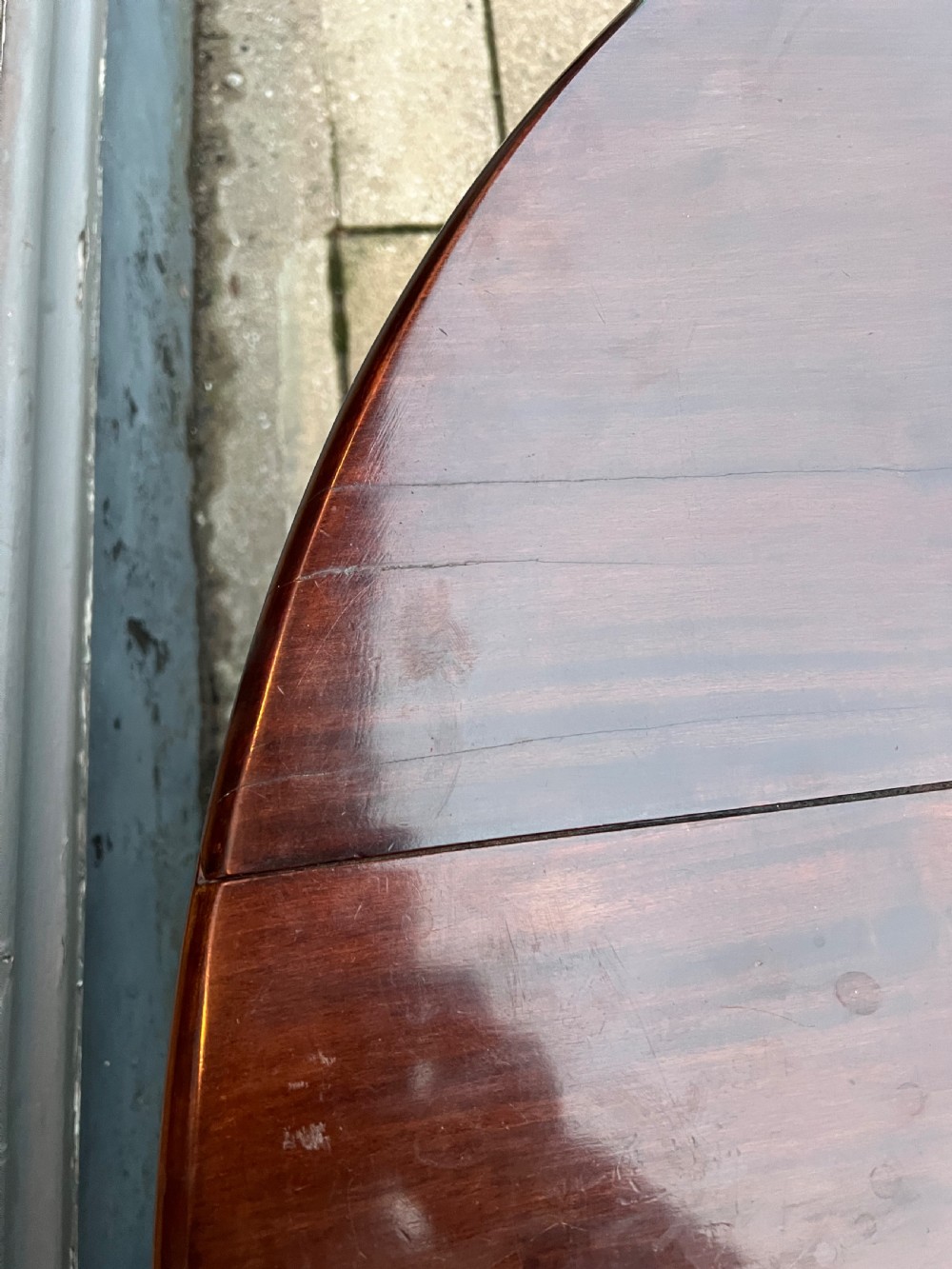 An 18th-century Cuban mahogany drop leaf table with curved cabriole legs and carved pointed pad feet. View XII