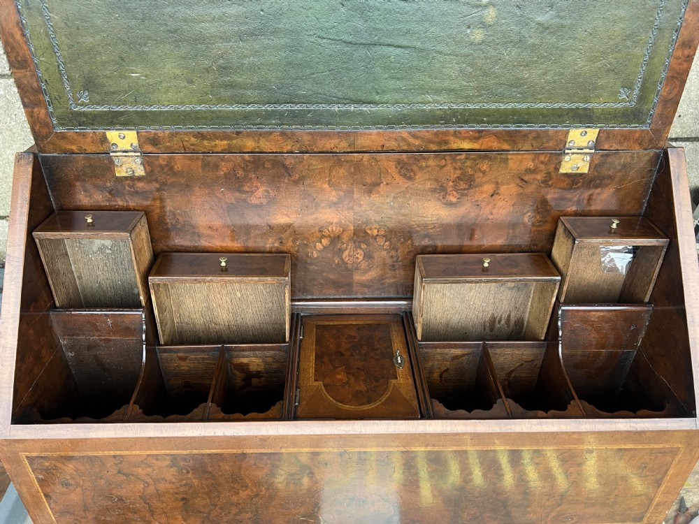 An 18th-century walnut and burr walnut slant-front bureau featuring crossbanded drawers, brass drop handles, and bracket feet. View VIII