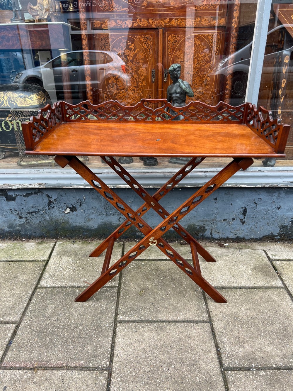 1930s  fretwork mahogany tray on stand in the Chippendale manner 