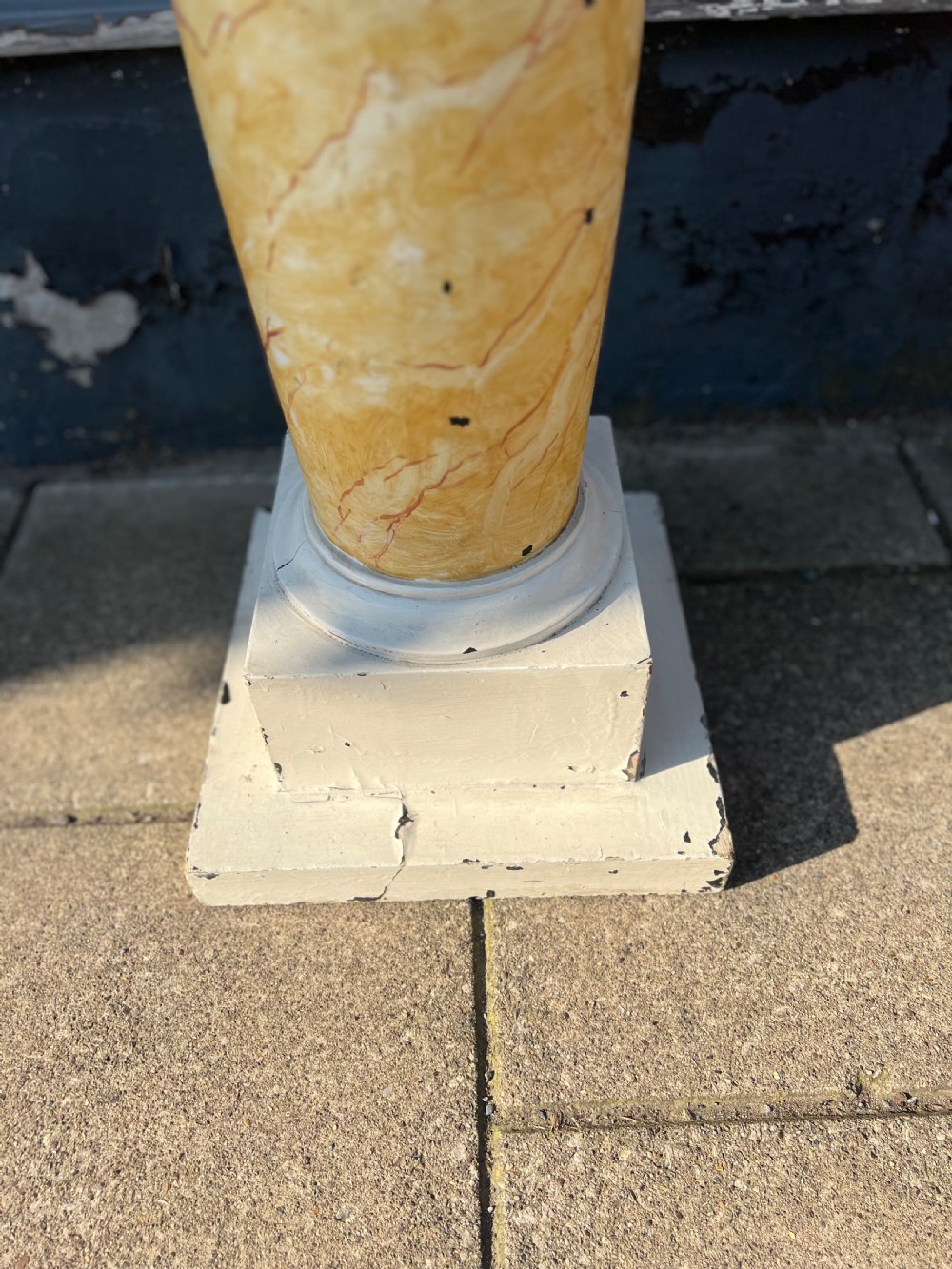 A 19th-century architectural column pedestal featuring hand-painted yellow faux marble veining with a cream-painted capital and base. View VII