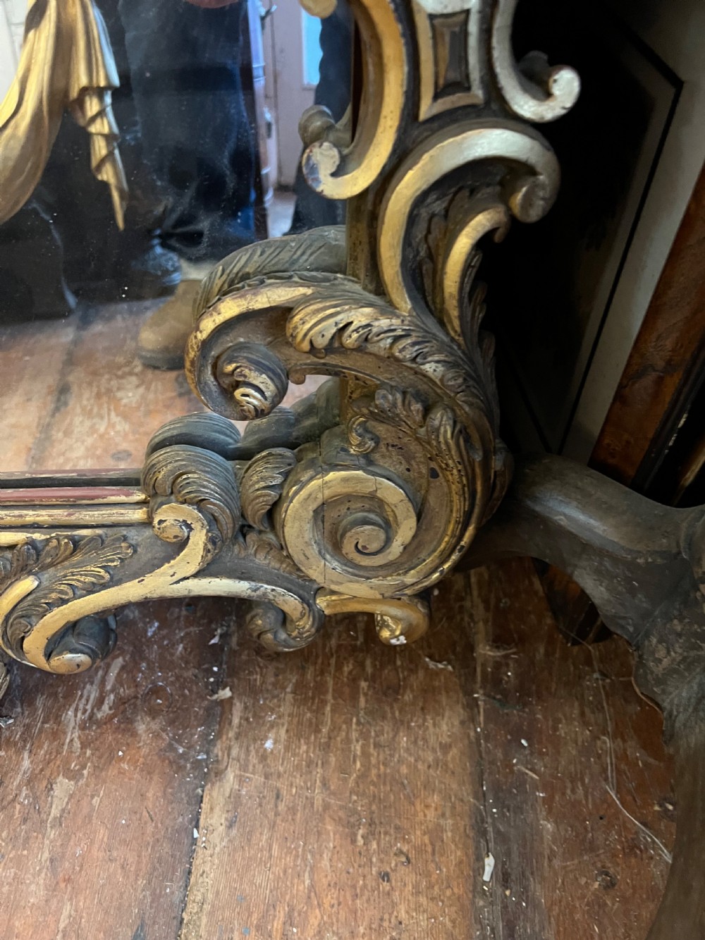 A 19th-century carved giltwood pier mirror featuring a Rococo cresting, scrolling acanthus leaf details, and an arched upper frame. View III