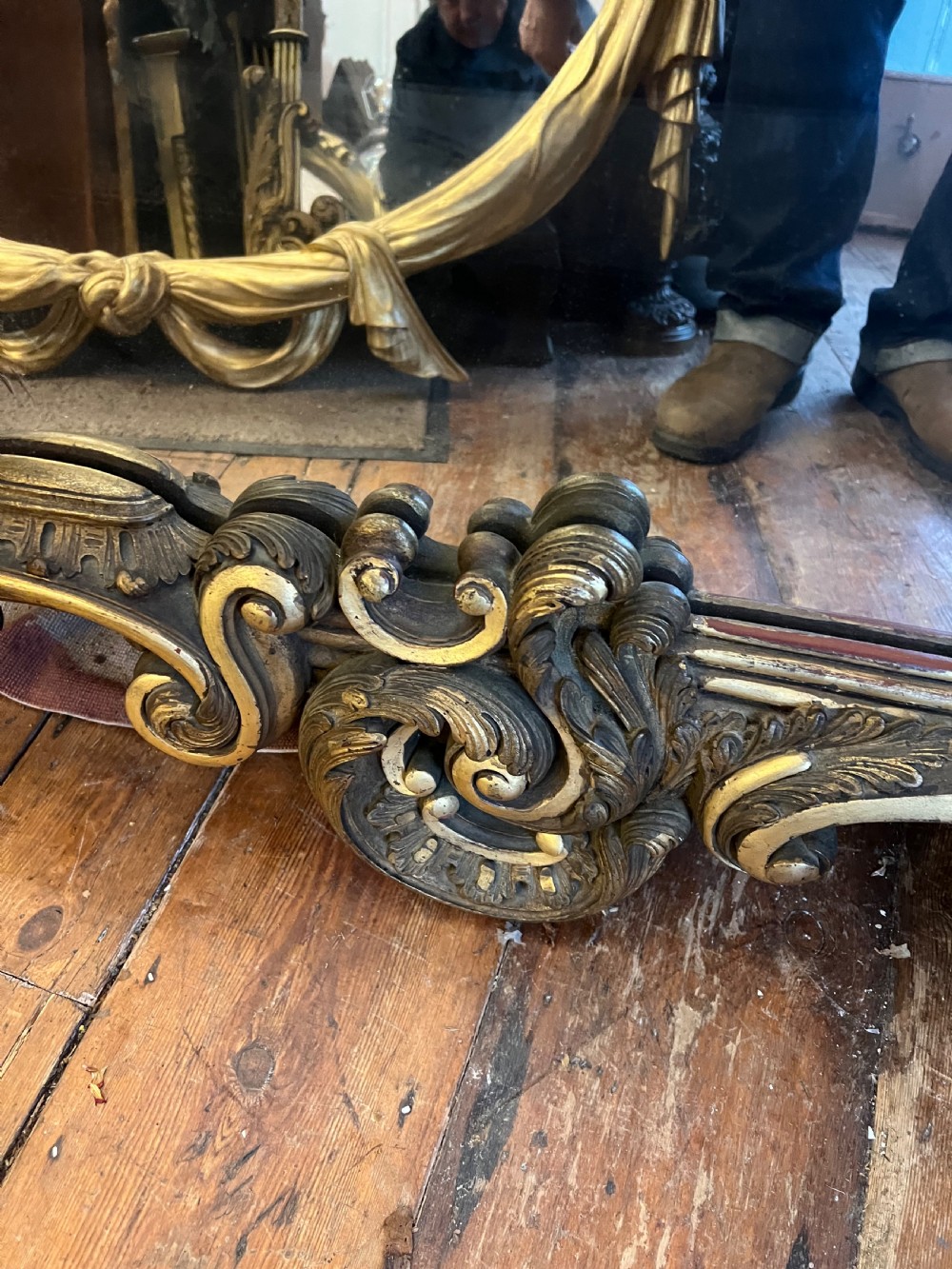 A 19th-century carved giltwood pier mirror featuring a Rococo cresting, scrolling acanthus leaf details, and an arched upper frame. View IV