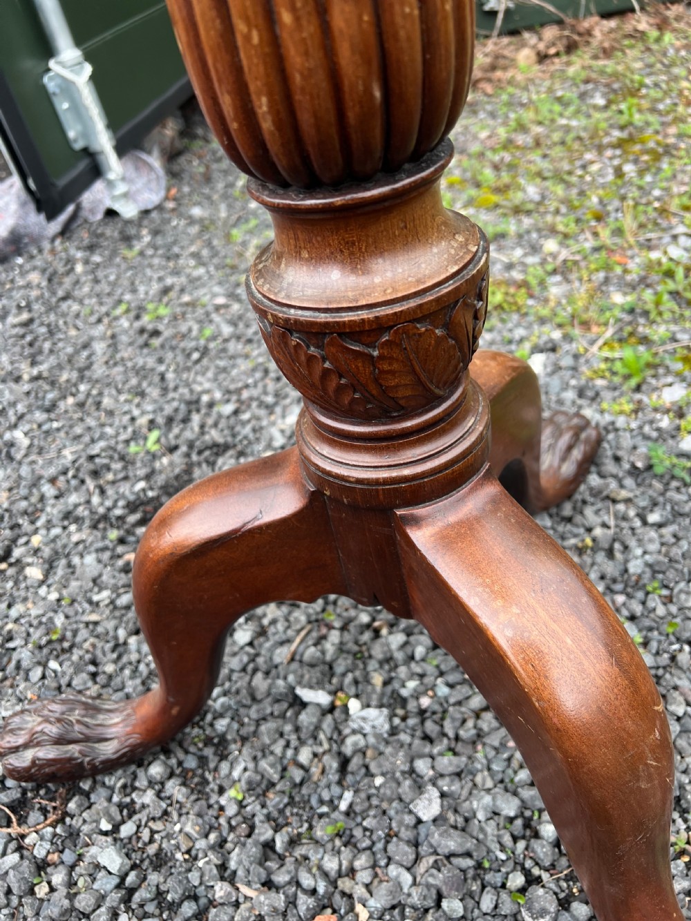 A tall nineteenth-century mahogany pedestal stand featuring a fluted column, acanthus leaf carving, and a tripod base with carved feet. View III
