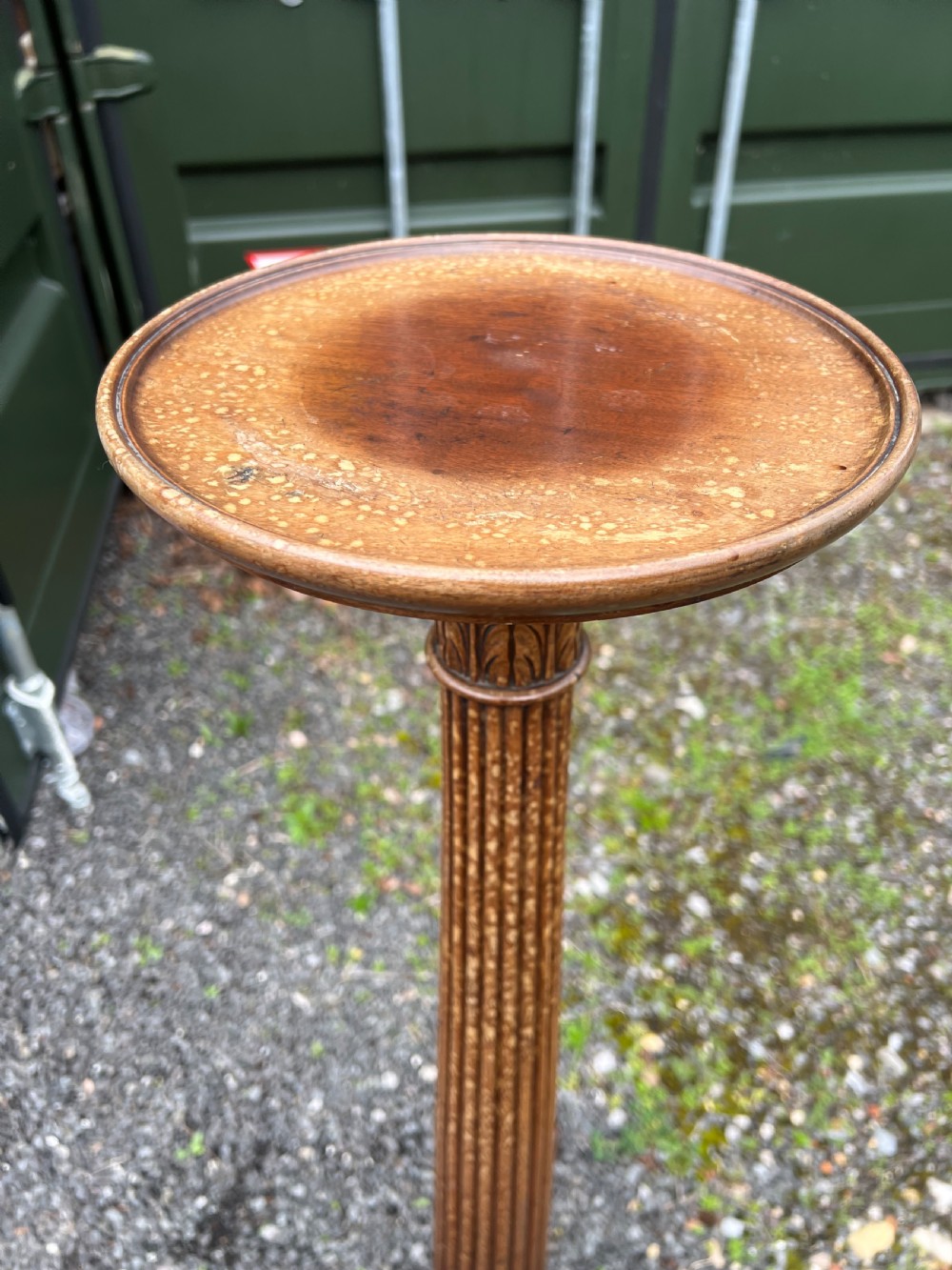 A tall nineteenth-century mahogany pedestal stand featuring a fluted column, acanthus leaf carving, and a tripod base with carved feet. View V