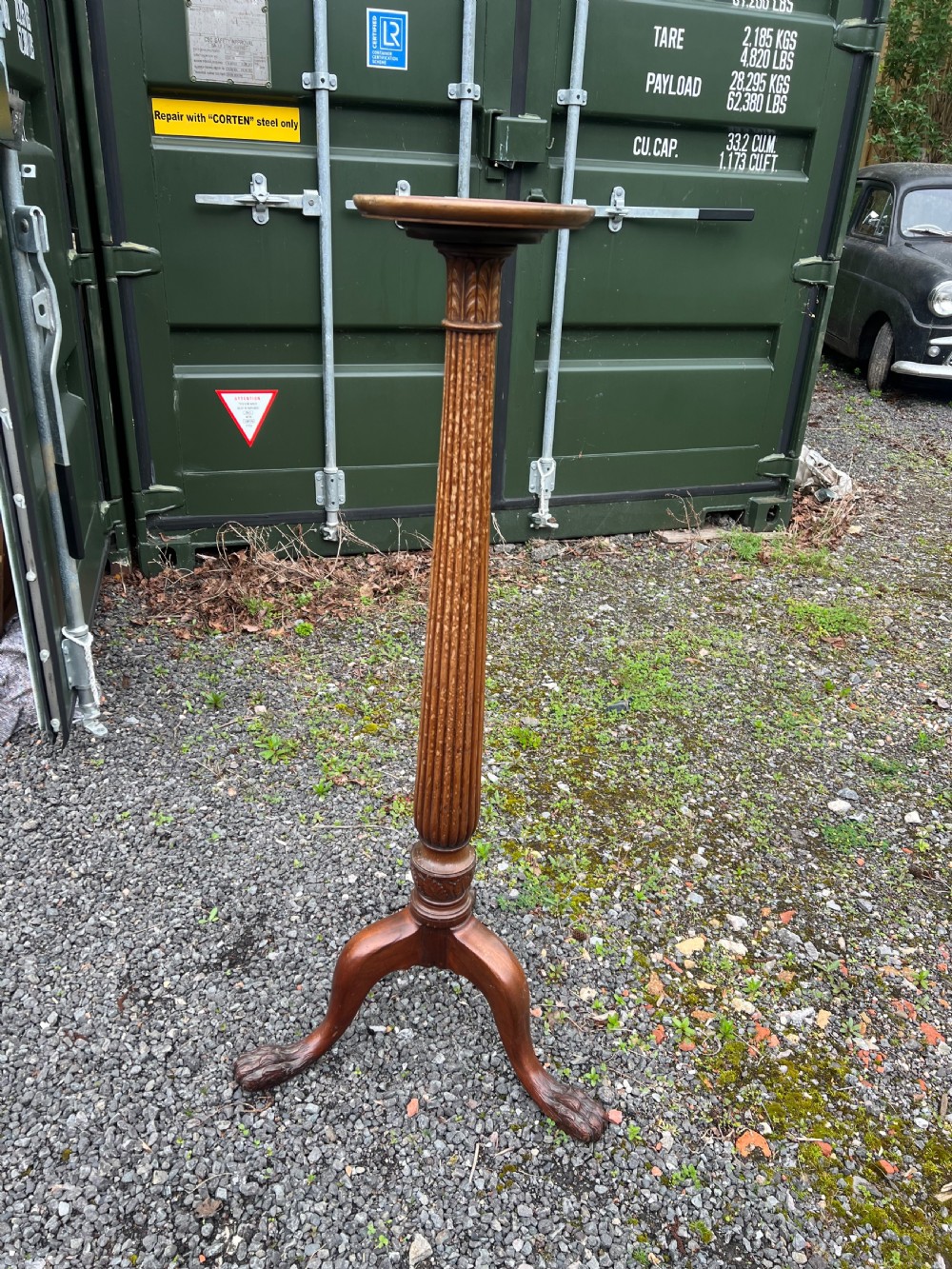 A tall nineteenth-century mahogany pedestal stand featuring a fluted column, acanthus leaf carving, and a tripod base with carved feet. View VII