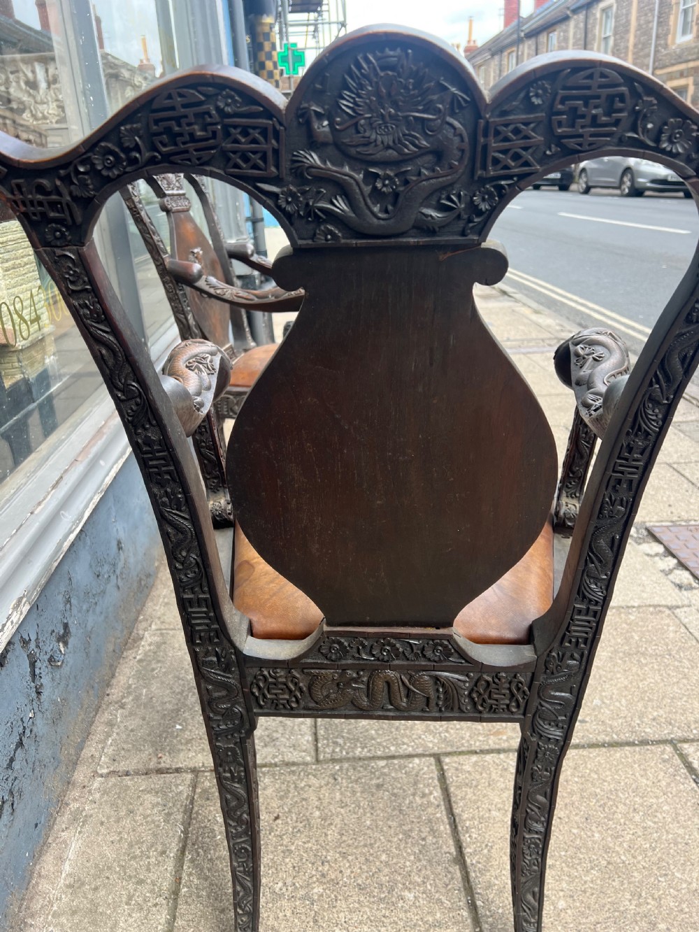 A pair of early C19th Chinese armchairs with crest to centre  View IV
