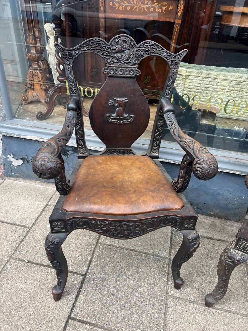 A pair of early C19th Chinese armchairs with crest to centre  View VI