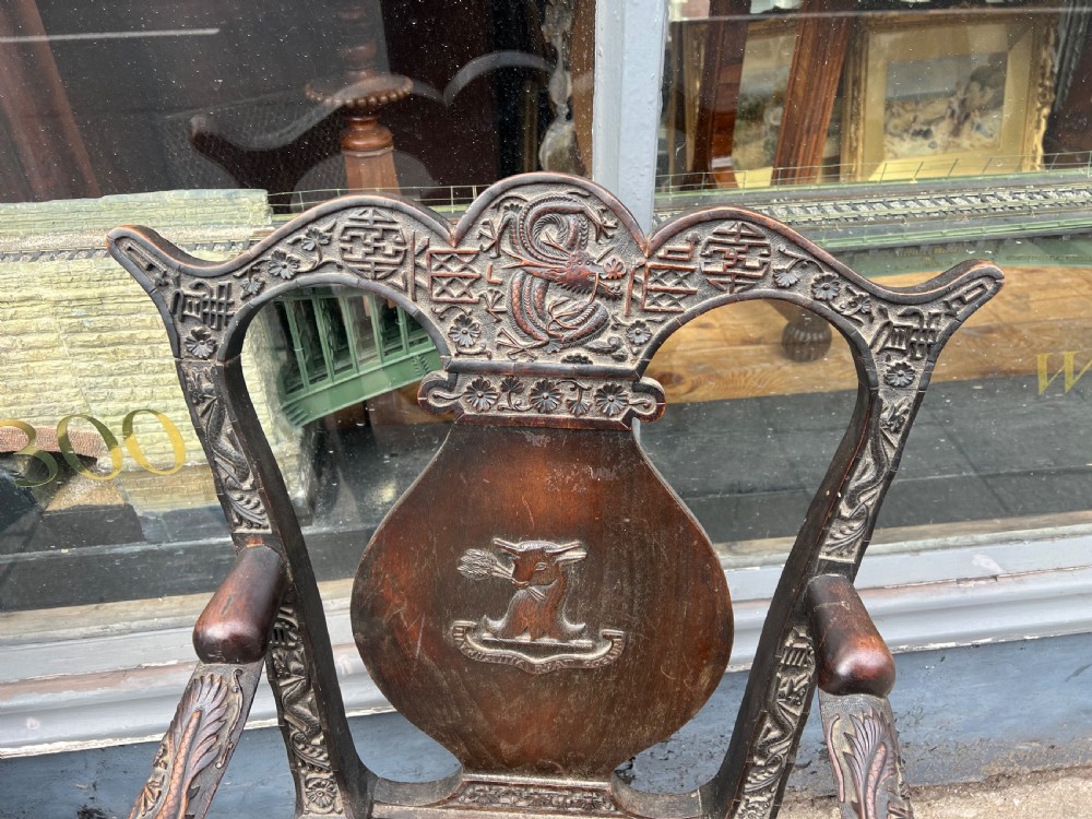 A pair of early C19th Chinese armchairs with crest to centre  View IX