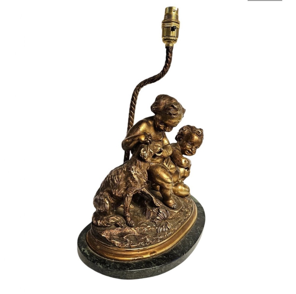C19th French gilt bronze of cherubs with a
Dog table lamp 