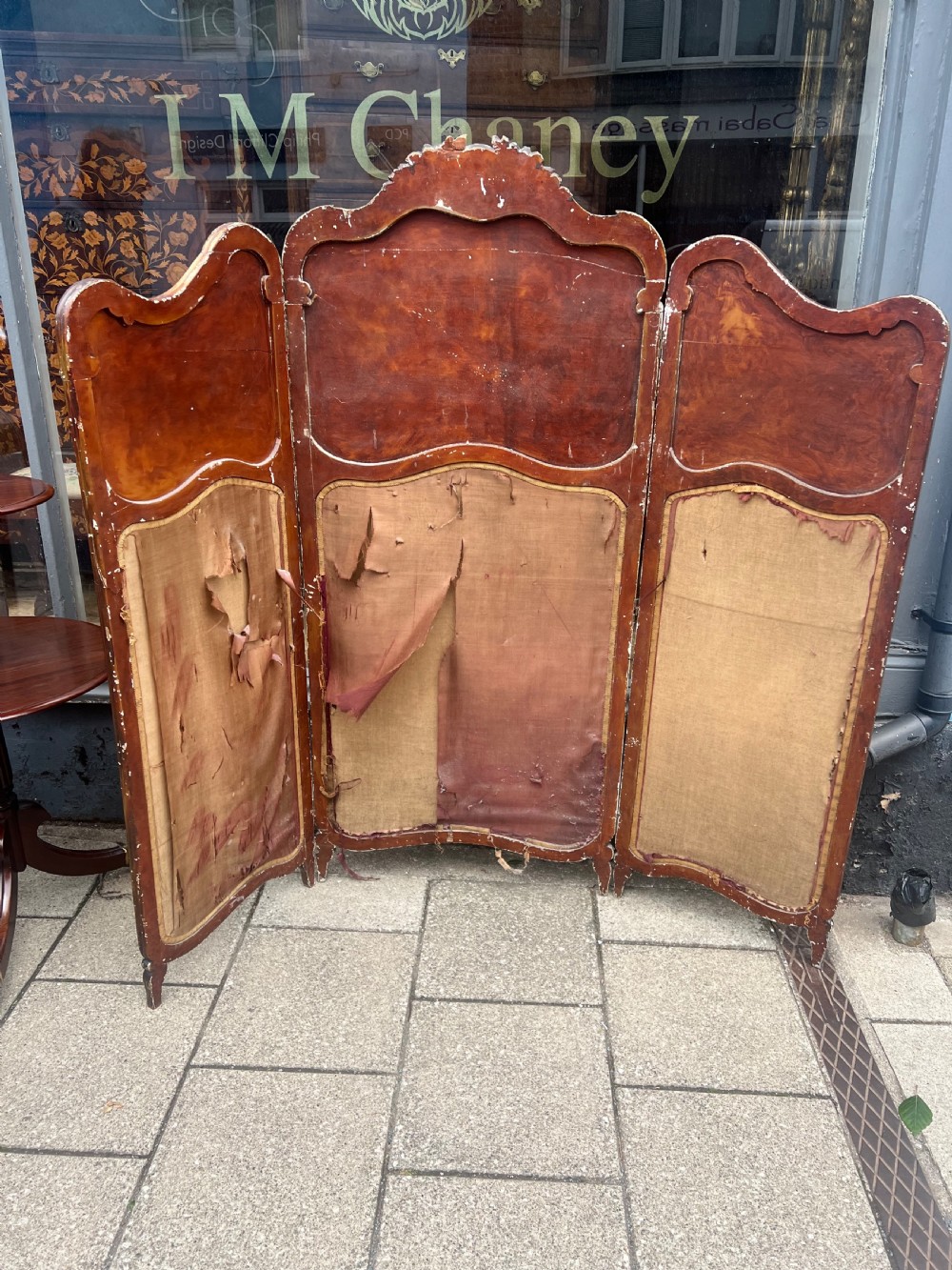 A three-panel French modesty screen featuring carved timber frames with oil-painted pastoral scenes on the upper panels and gold velvet upholstery on the lower panels. View II