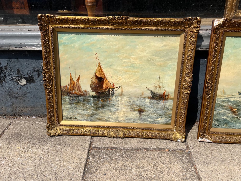 A pair of antique oil paintings on board depicting sailing ships on choppy waters, framed in ornate gold gilt frames. View III