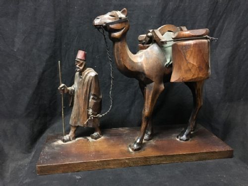 Carved Wooden Man Leading a Camel.