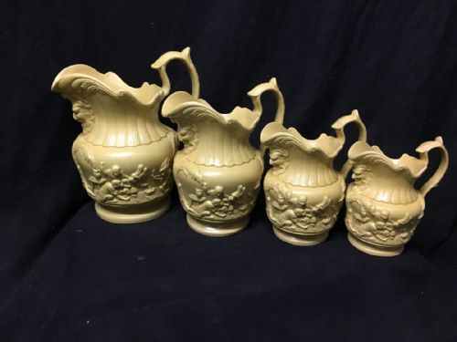 C19th Graduated Set of Stoneware Jugs Depicting Monkeys