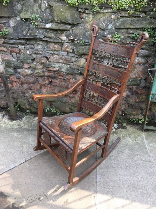 fig 1. C19th rocking chair in the Carlo Bugatti style.