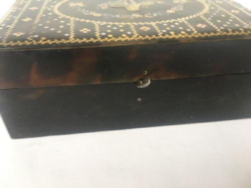 fig 1. C19th tortoishell box inlaid with gold and silver