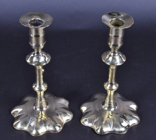 An C18th Pair of Petal Based Brass Candlesticks
