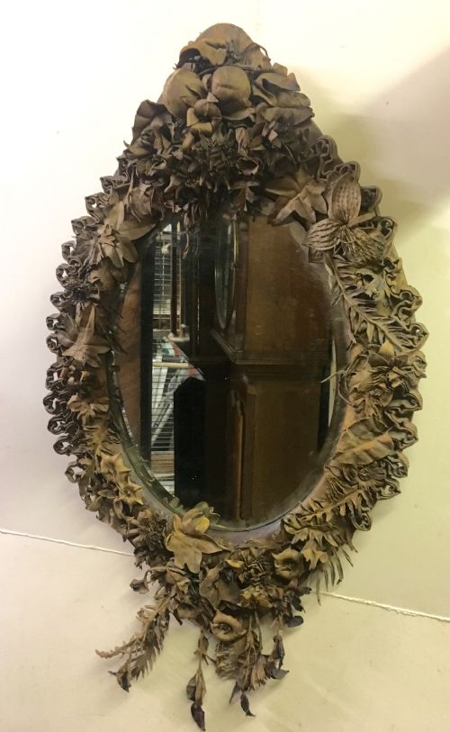 Oval Folk Art Mirror  Decorated with Shaped Leather