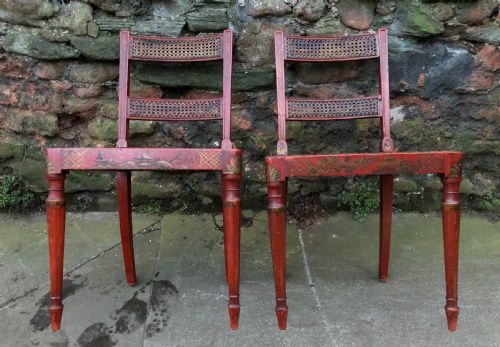 A Good Pair of Chinoiserie Decorated Red Lacquered Chairs