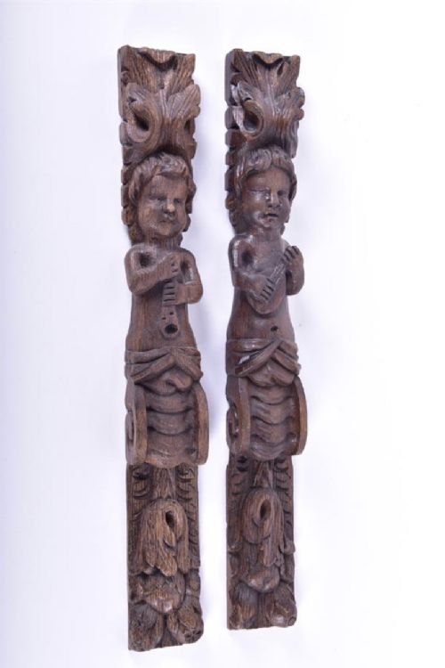 Pair of Carved Oak Wall Hangings Showing Musicians