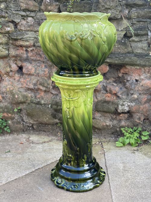 A Victorian Majolica Green Glazed Jardinaire and Stand