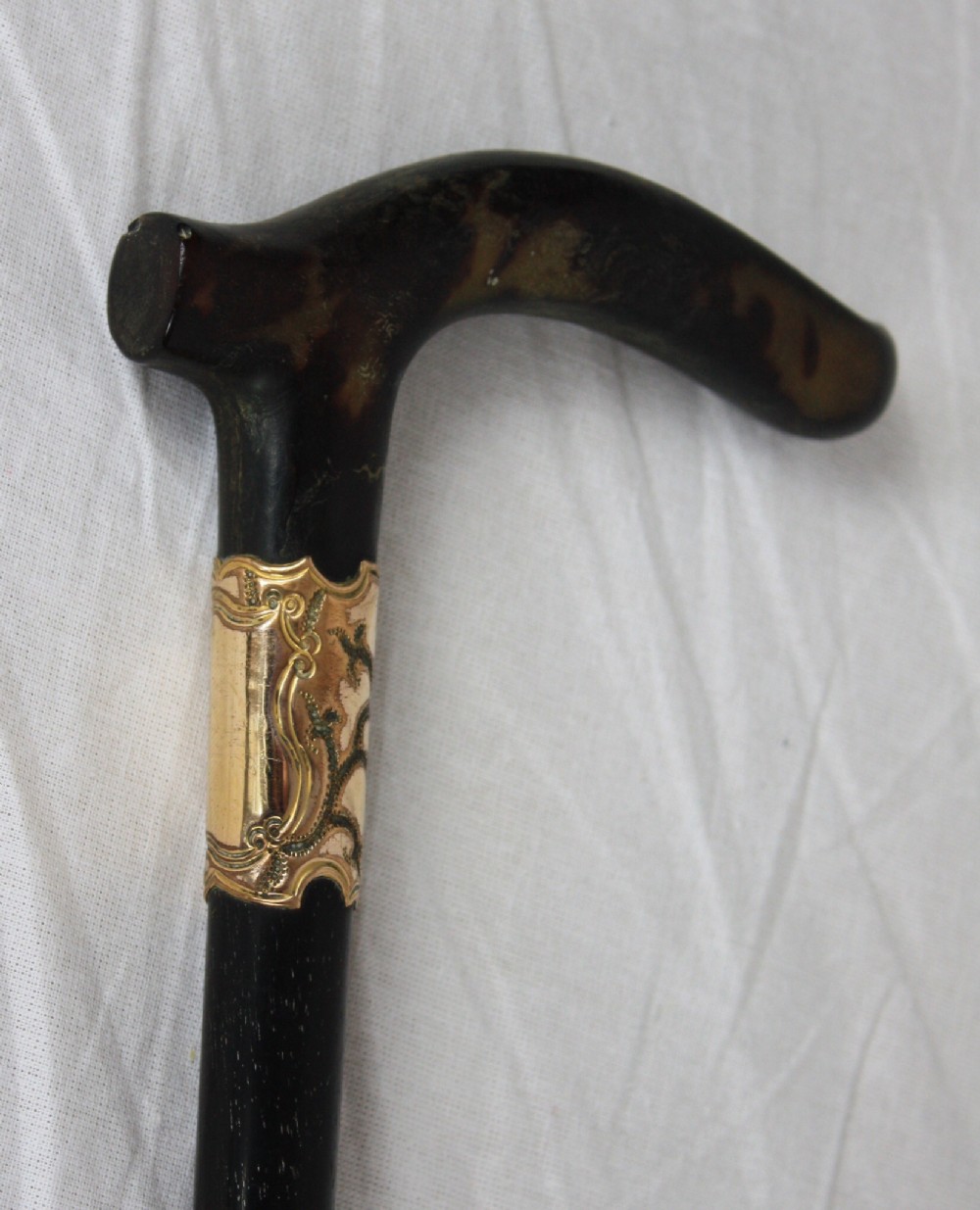 Tortoishell and gold collared walking stick
