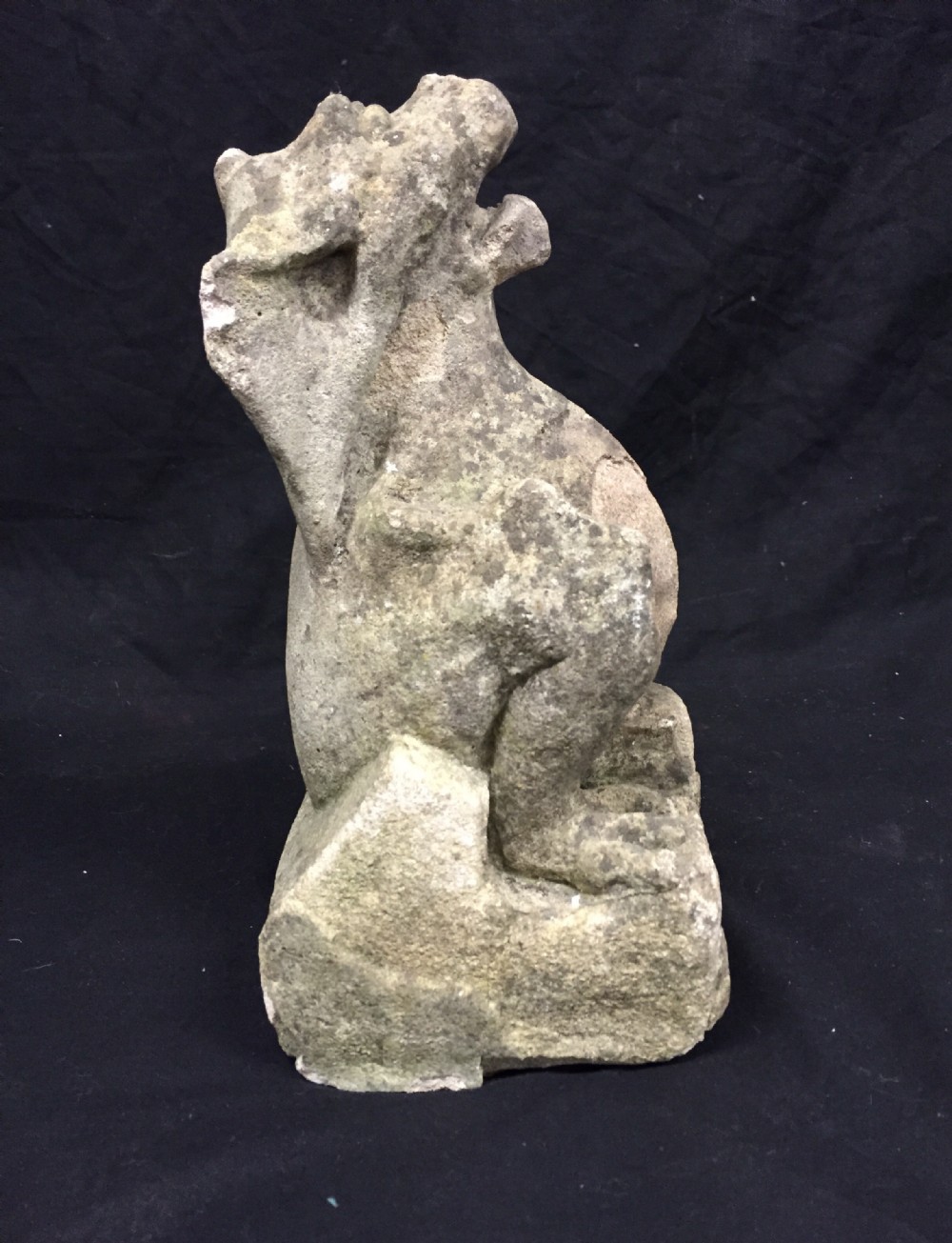 Carved stone griffin gargoyle
