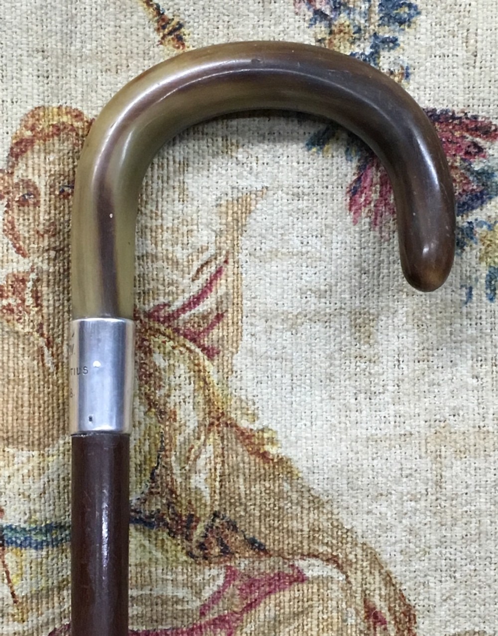 Early C20th horn handled silver coloured walking stick.
