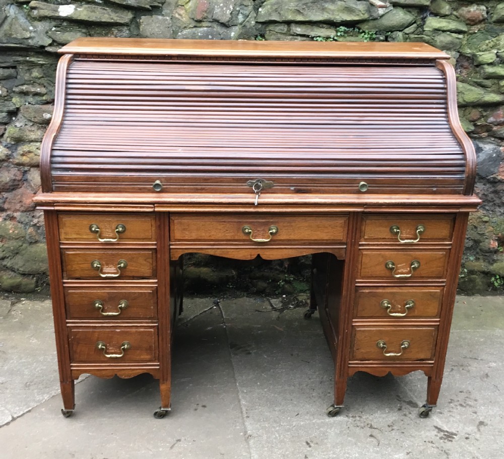 C19th walnut serpentine roll top desk 