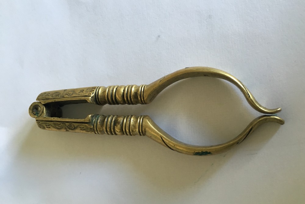 A George III brass lever-action nutcracker, with maker's stamp for Thomas Bingham of Birmingham
