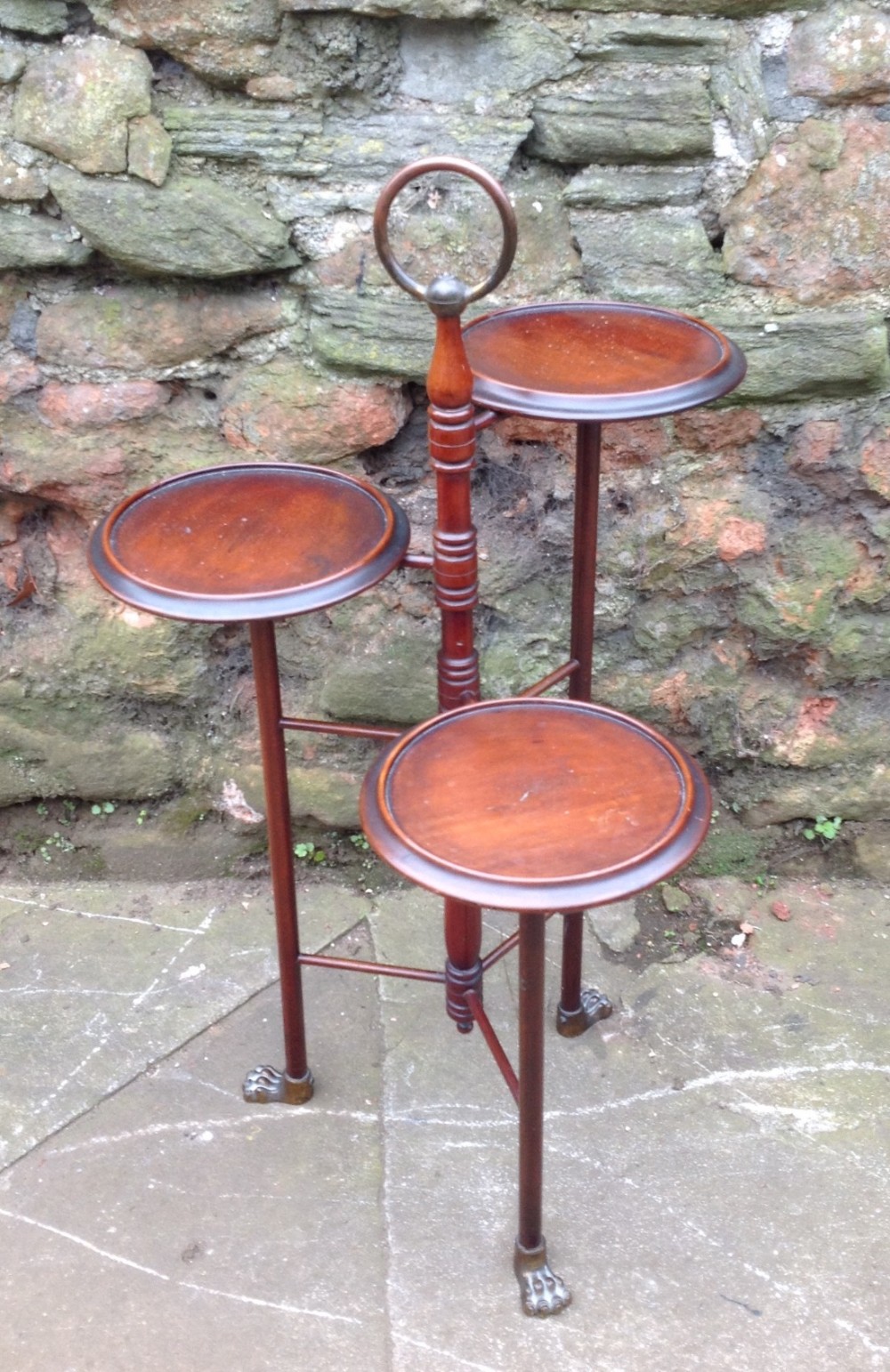 Edwardian mahogany and brass display stand.