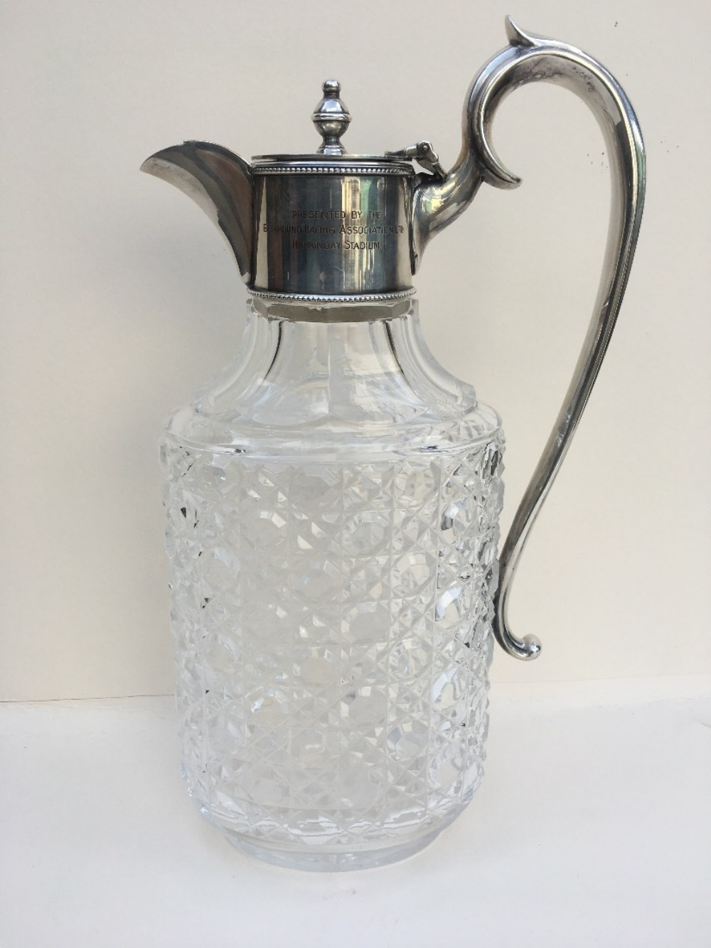 Silver plated cut glass claret jug