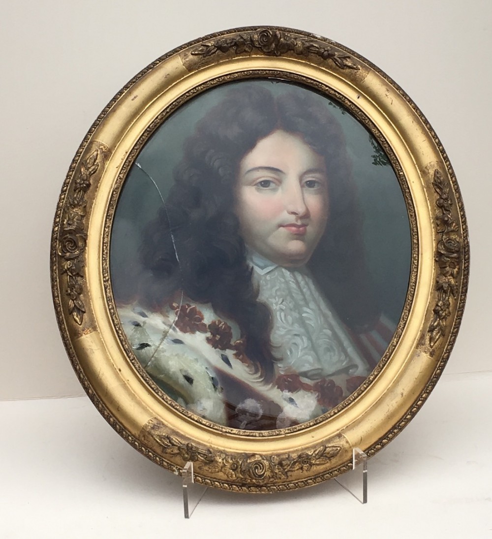 C19th portrait of a nobleman painted on glass in an oval frame.