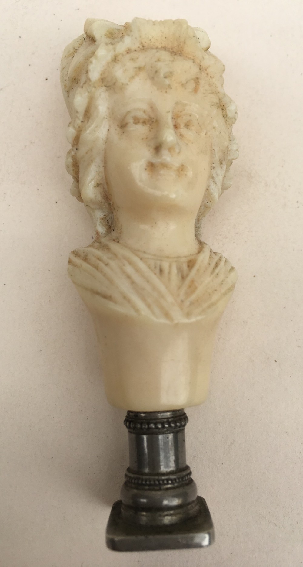 C19th carved Ivory dieppe carving of a lady with a seal base