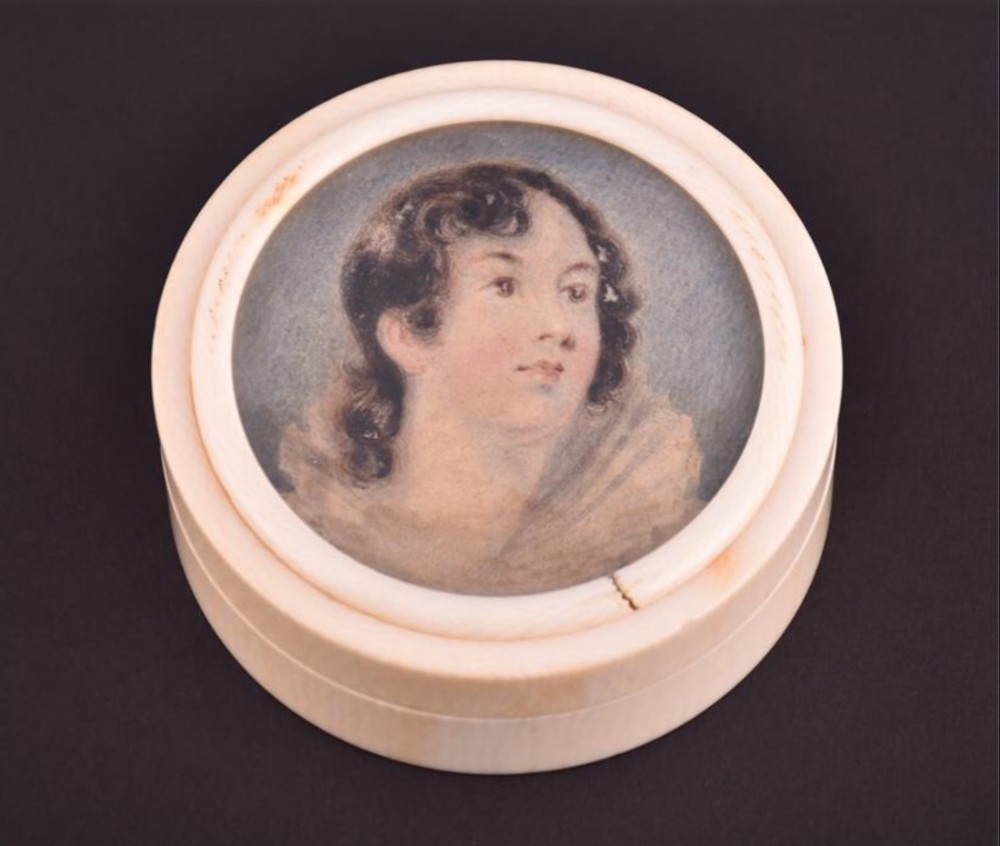 C19th portrait miniature of a young lady inset in an ivory round box