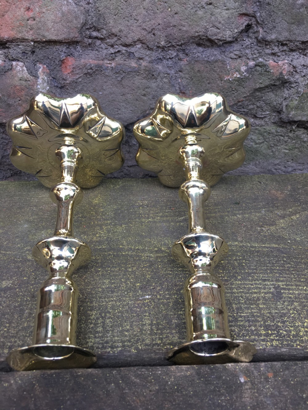 An C18th pair of petal based brass candlesticks  View IV