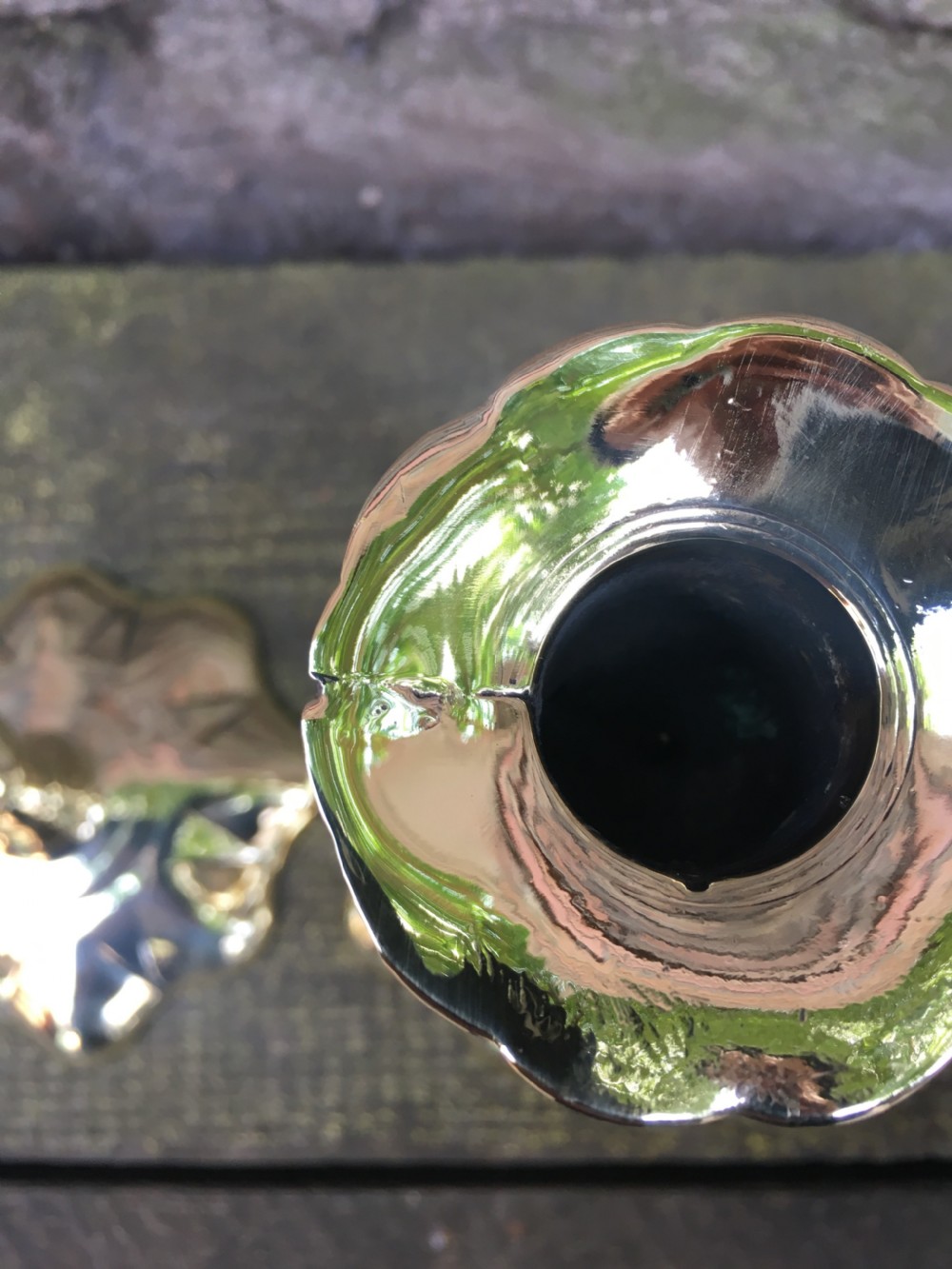 An C18th pair of petal based brass candlesticks  View VII