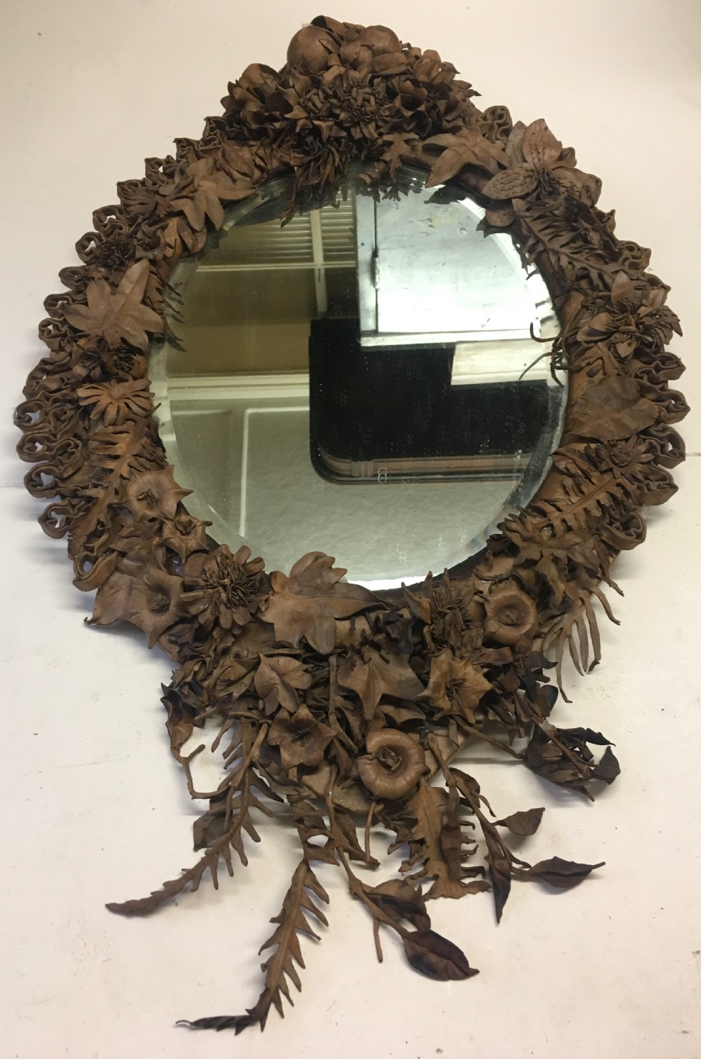 oval folk art mirror  decorated with shaped leather View IV