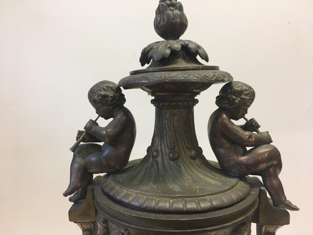 C19th gilt classical metal vase with cherub decoration View IV