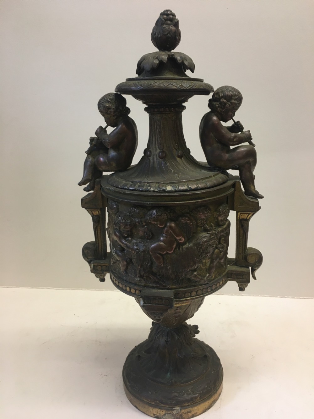 C19th gilt classical metal vase with cherub decoration View VI
