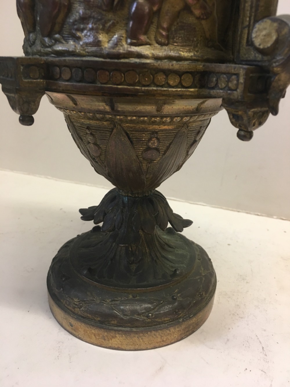 C19th gilt classical metal vase with cherub decoration View VIII