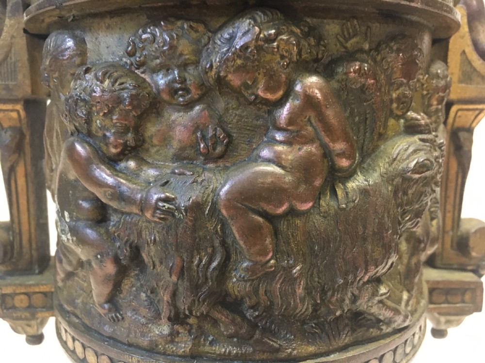 C19th gilt classical metal vase with cherub decoration View X