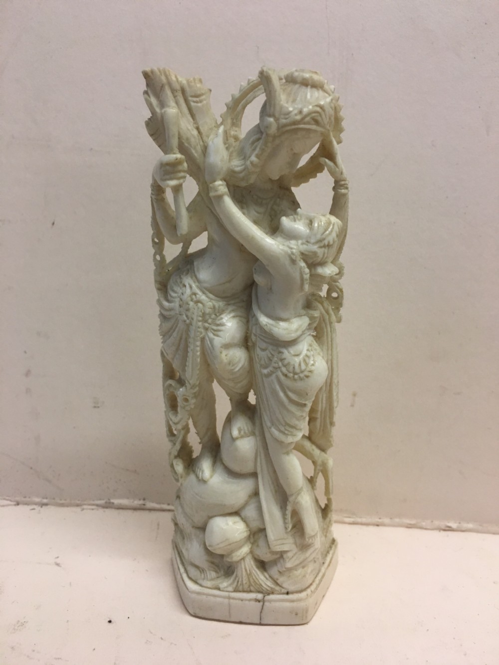 Edwardian period ivory carving of a couple embracing