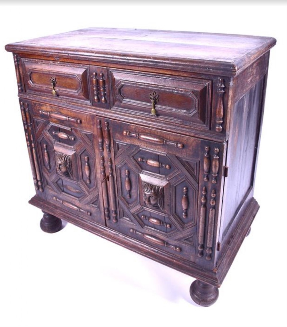 A late C17th oak cupboard 95 cms wide