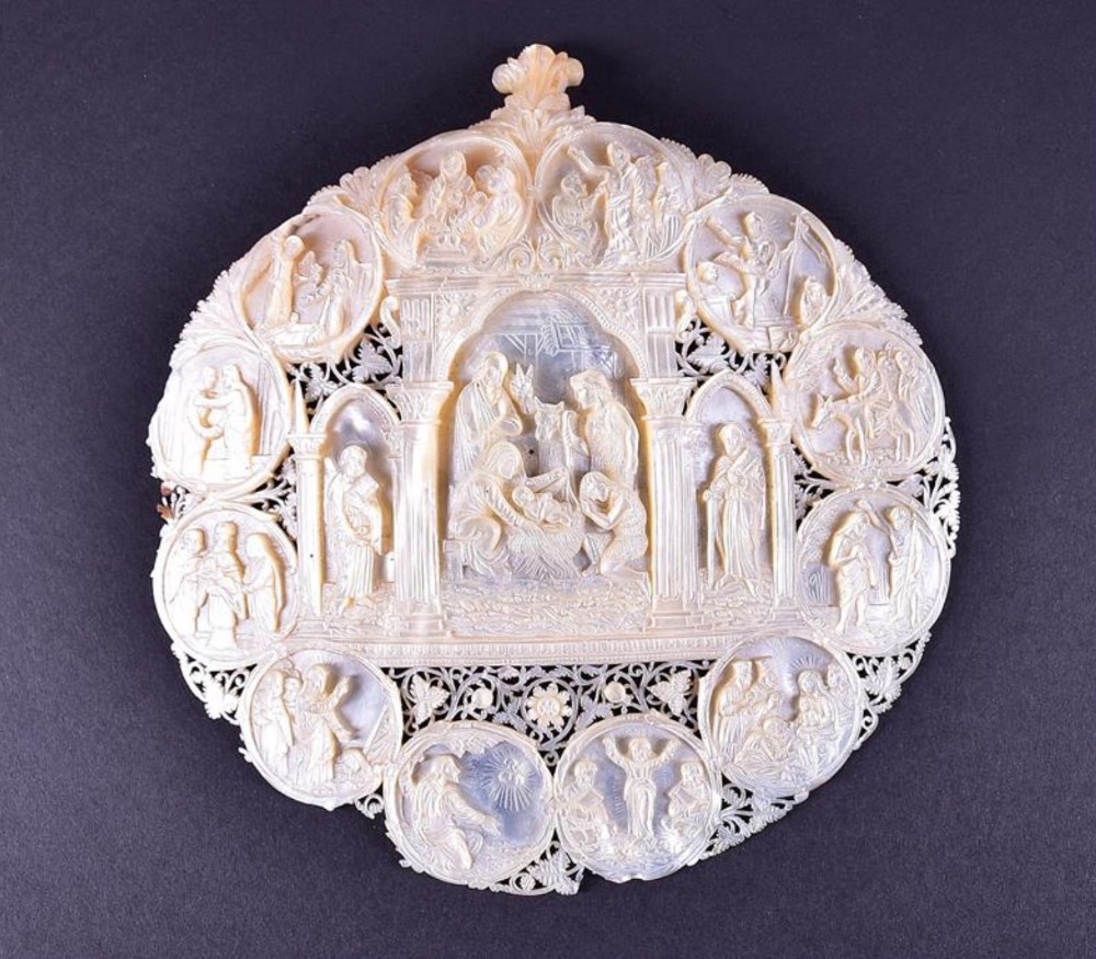 A finely carved 19th century mother-of-pearl devotional 'pilgrim's plaque'