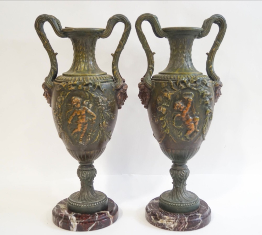 Pair of painted spelter urns 