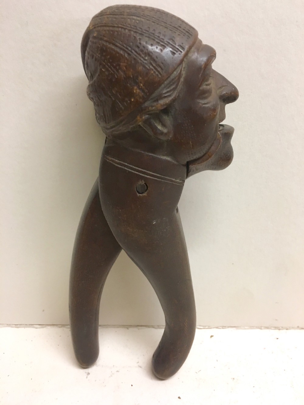C19th Swiss carving of a man modelled as a nut cracker. View II