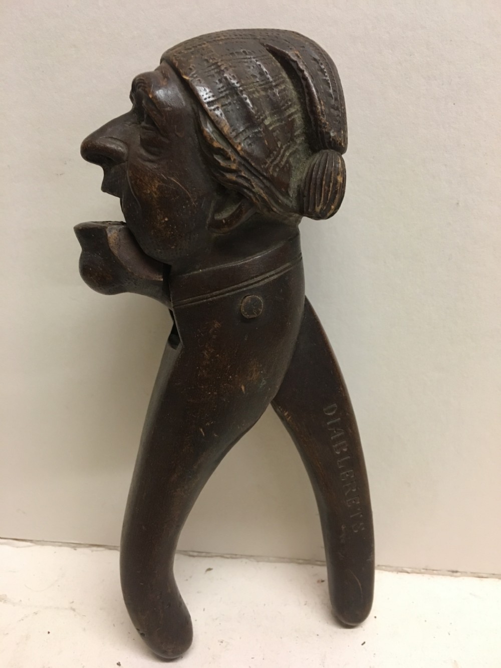 C19th Swiss carving of a man modelled as a nut cracker. View IV