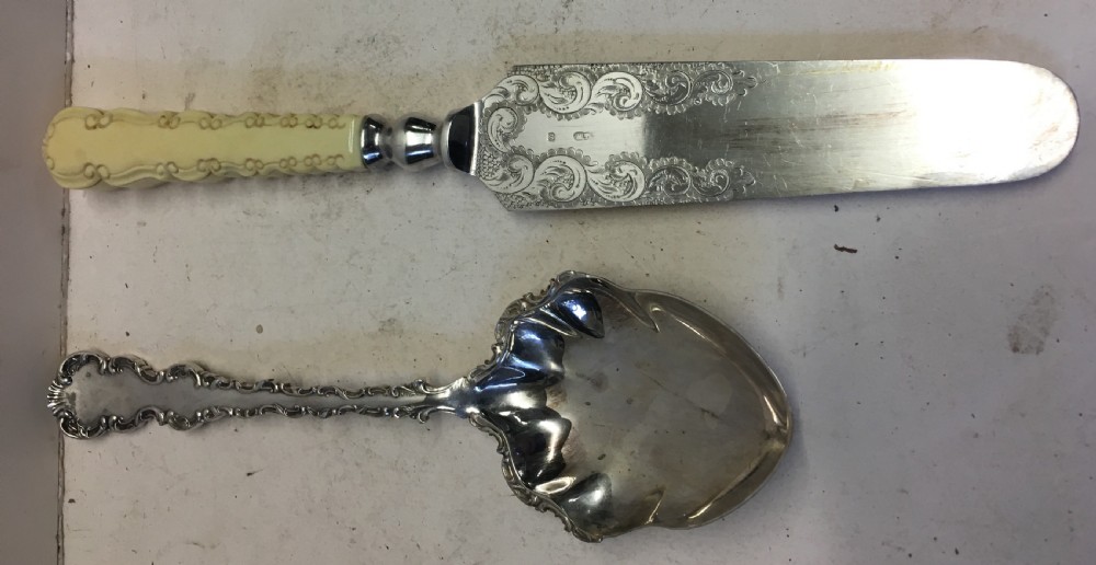 Pair of silver plated servers in a fitted case. View II